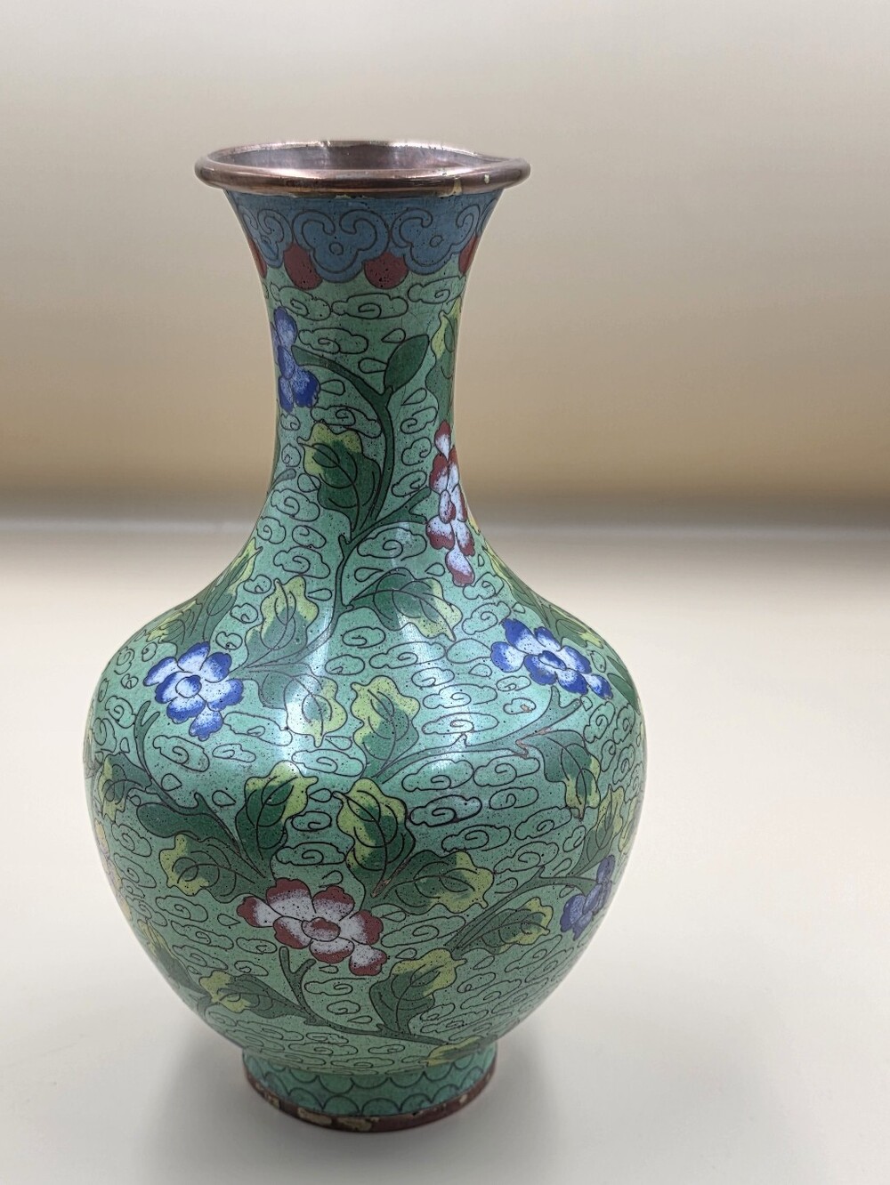 vintage Chinese copper and enamel cloisonné vase featuring a green floral motif